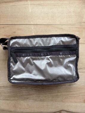 Lesportsac Metallic Silver Crossbody Purse with Dark Trim and lots of pockets